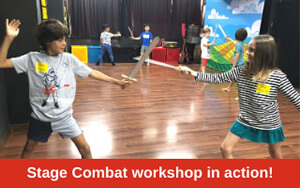 Children practising their stage combat skills in Faust’s workshop